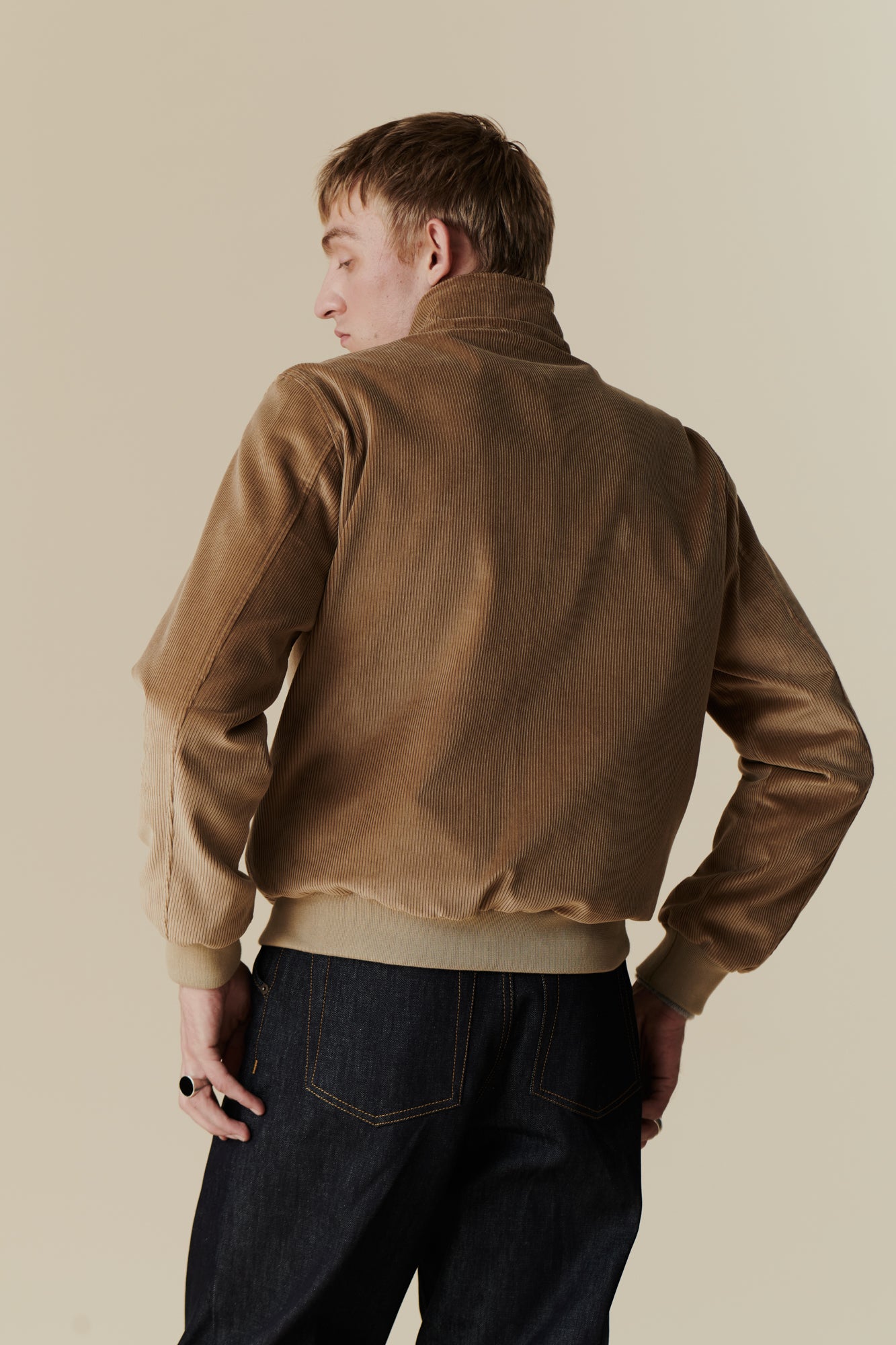 Male wearing corduroy harrington jacket in stone