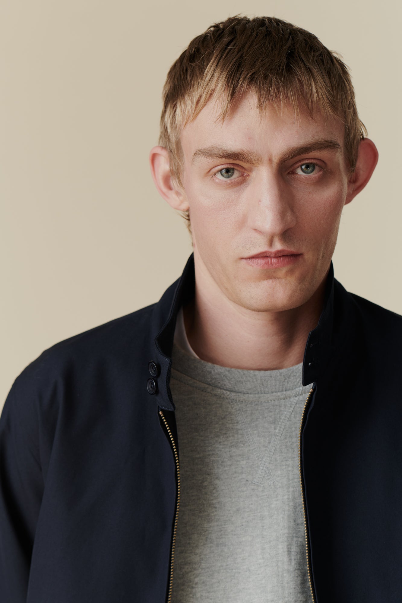 Portrait of male wearing Harrington jacket in navy