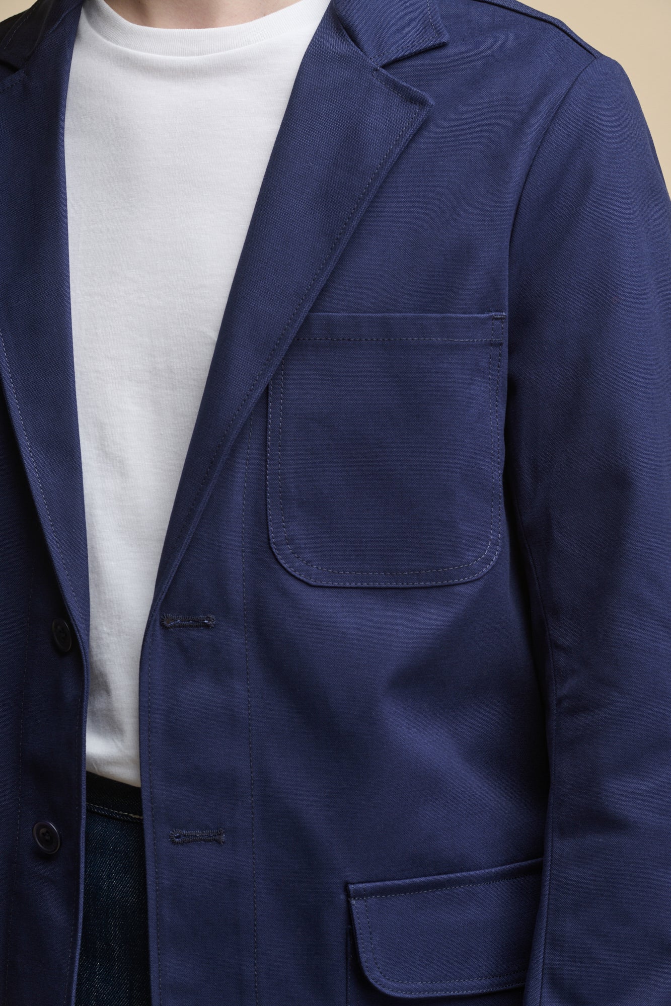 Close up detail image of Men's James Single Breasted Blazer in Navy with two front button fastenings and chest pocket