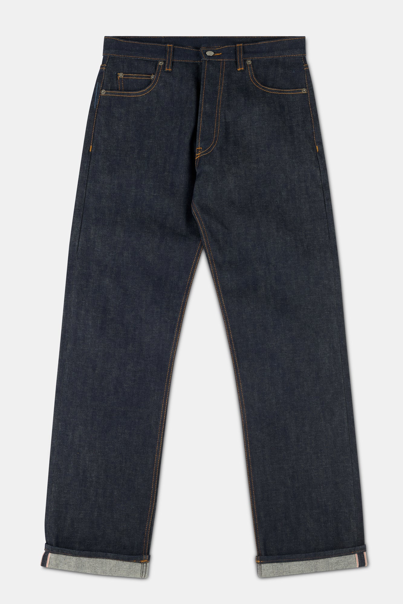 Pair of indigo denim jeans on a white background.