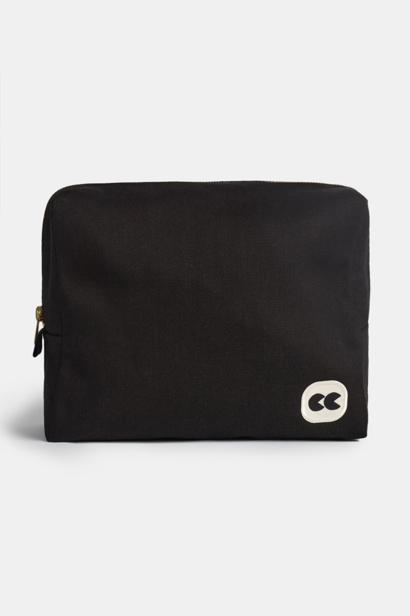 Image of front of medium sized pouch, small CC logo on the bottom right