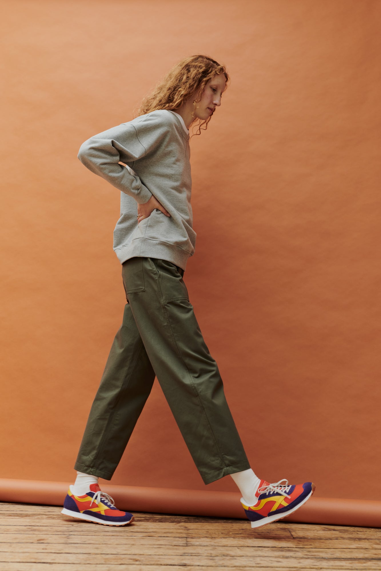 Full body side image of female in combat trouser olive