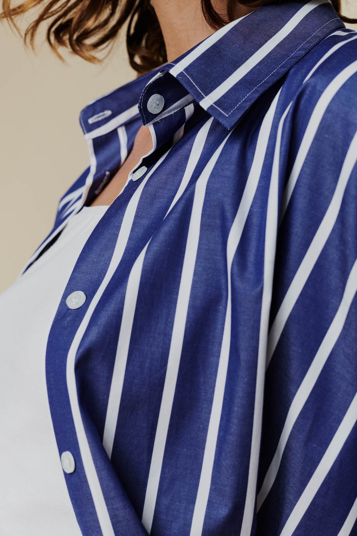 Close up of the blue and white stripes of the Ava shirt