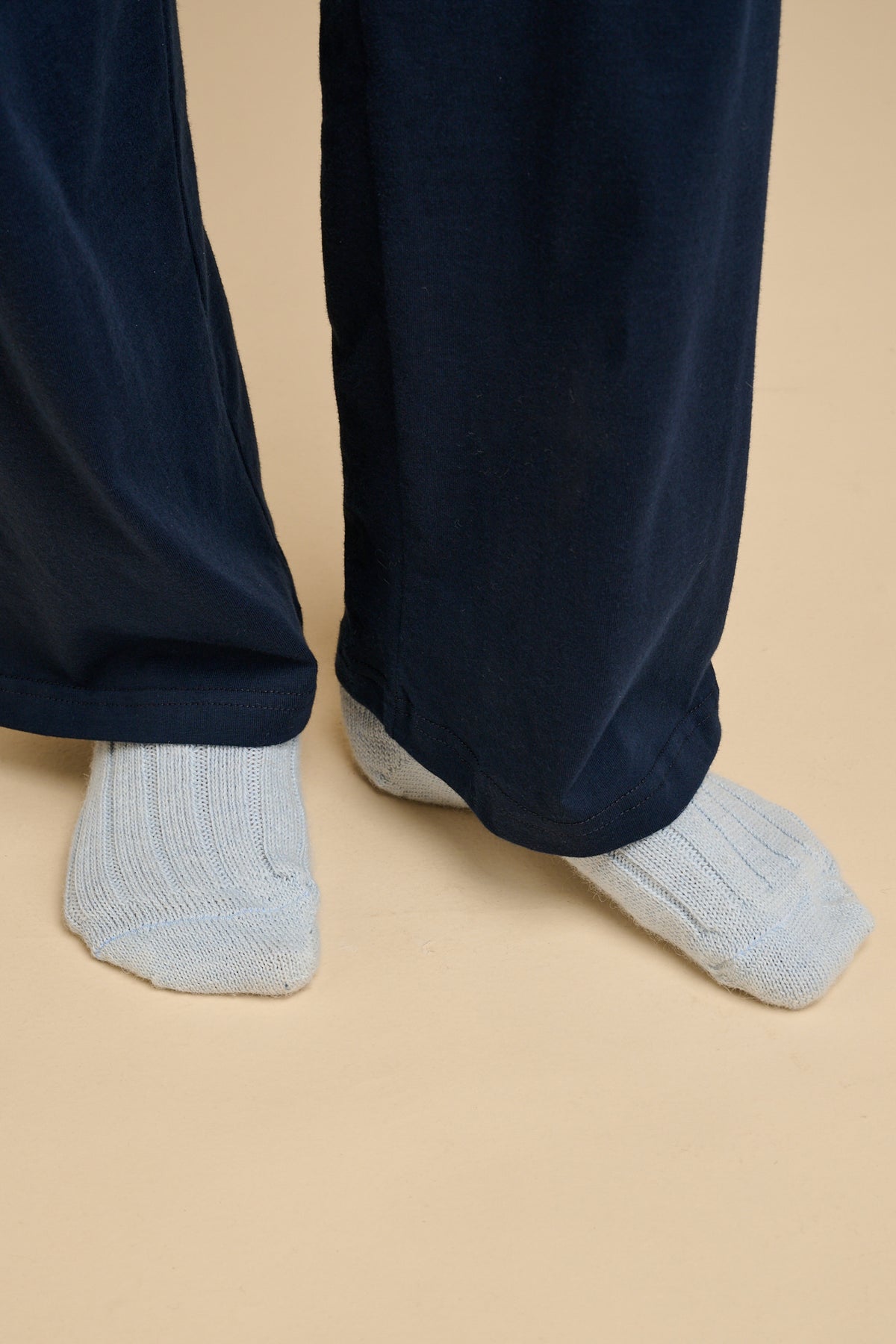 Navy jersey pyjama trousers and light blue alpaca socks