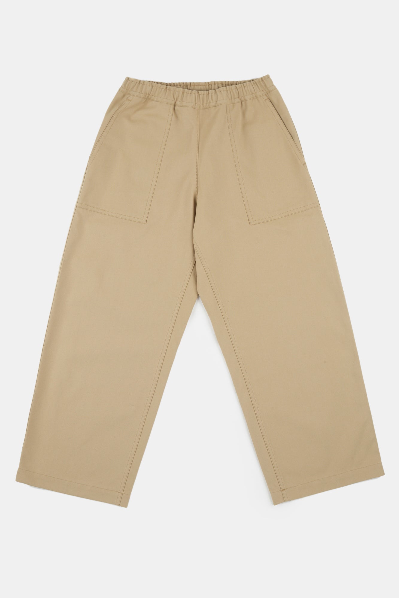 Flatlay product shot of cameraman pants in putty