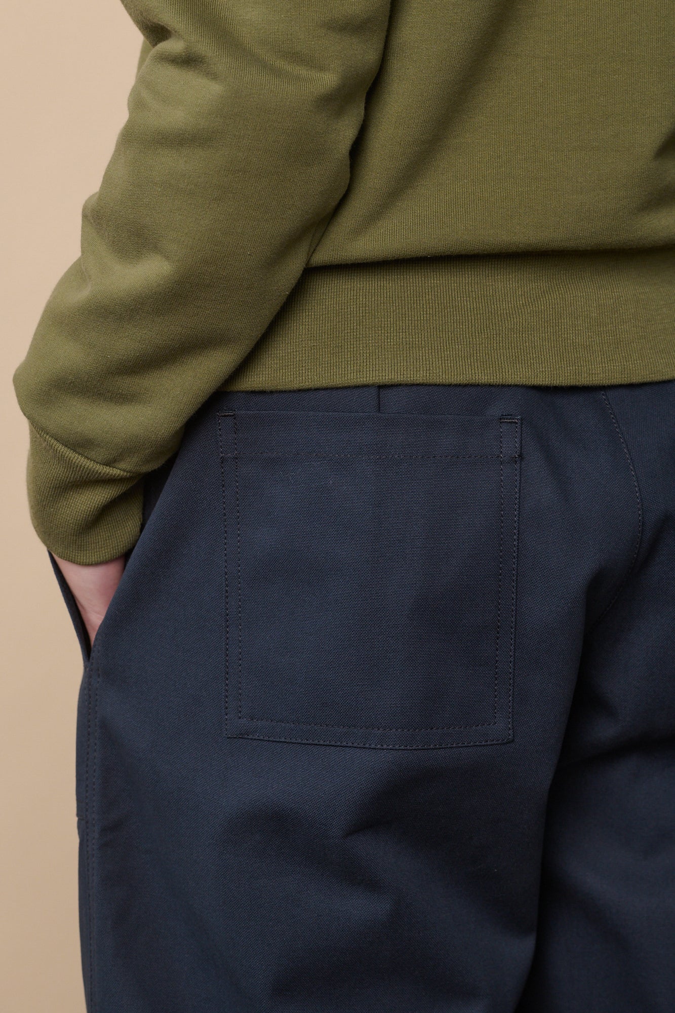 Back pocket detail of camerwoman pant in navy