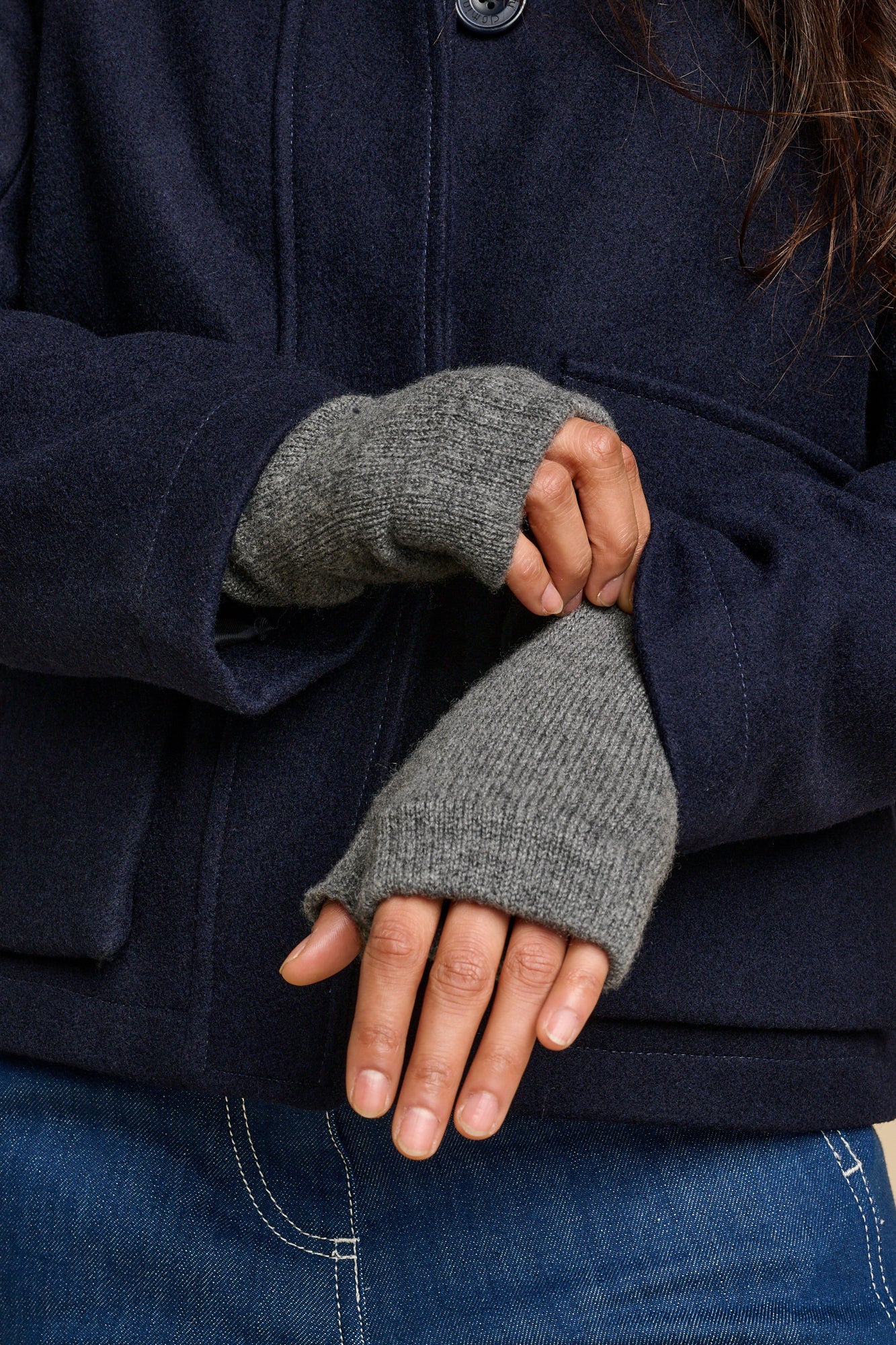 Female wearing cashmere fingerless gloves in charcoal