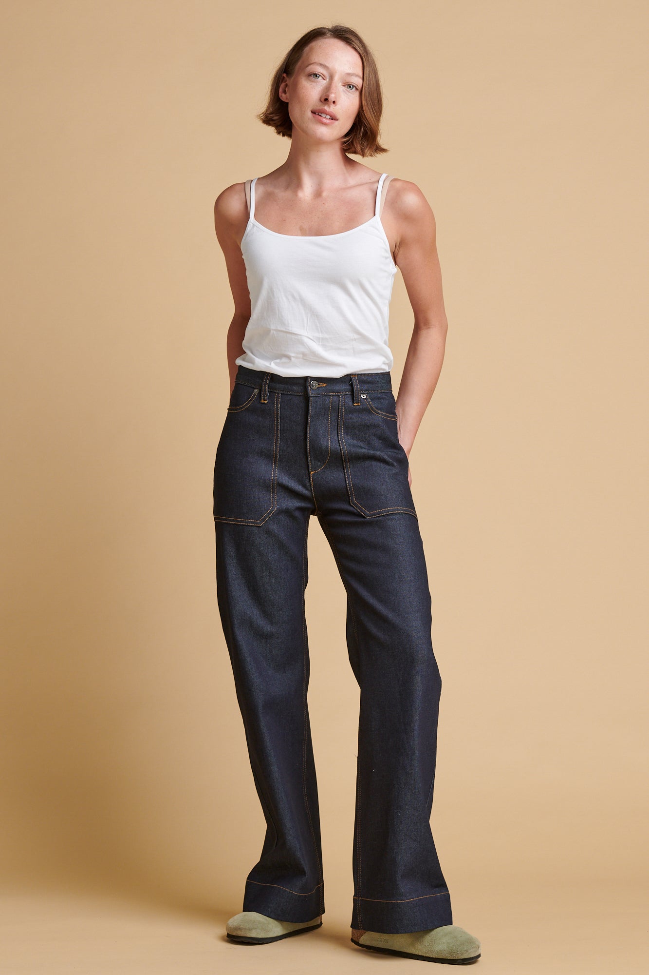 Female wearing high rise wide leg Linda jean.