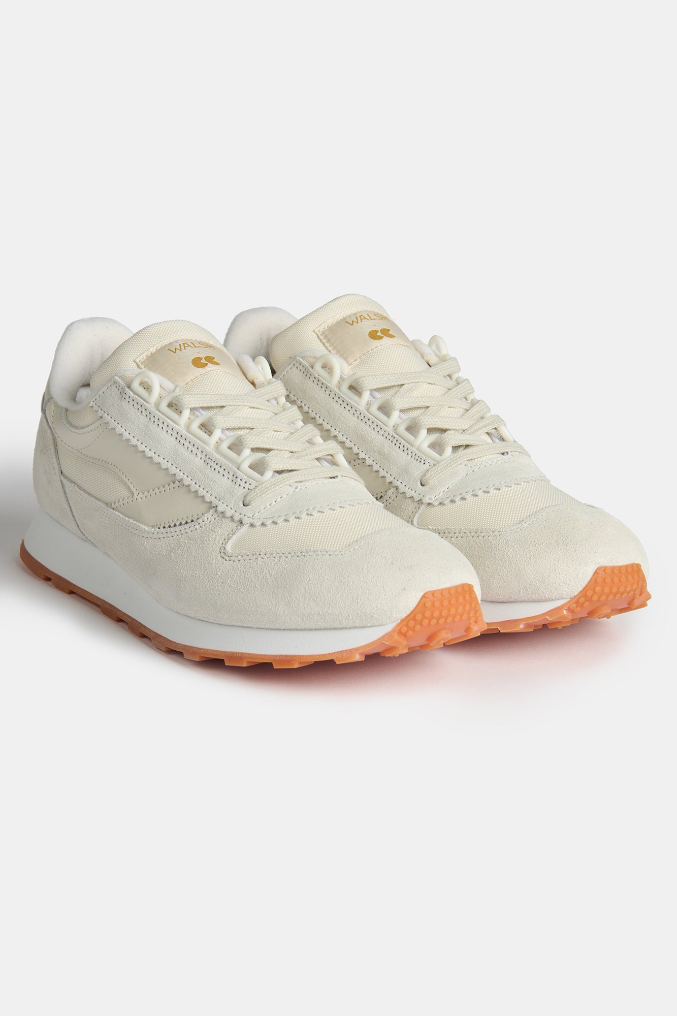 Flatlay image of the pair of Walsh X CC Parlick trainers in Ivory/Stone/White