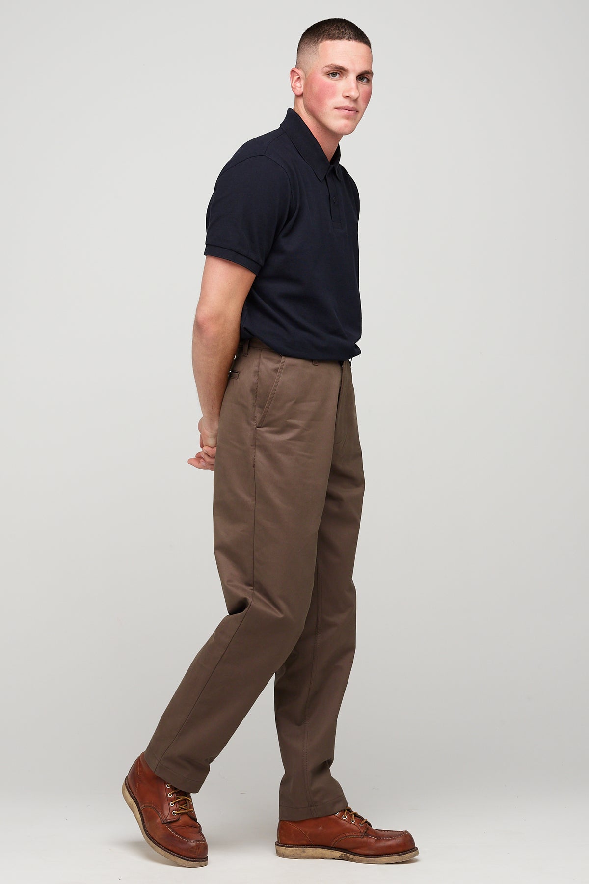 white brunette male in heavyweight relaxed chino brown styled with short sleeve polo shirt
