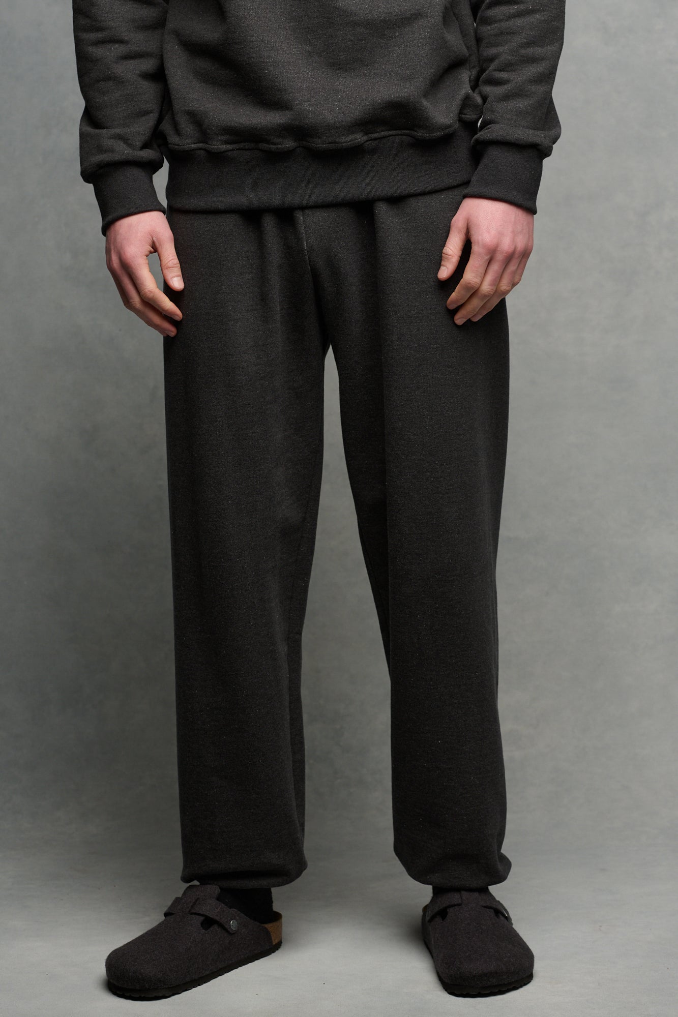 Waist down image of male wearing heritage sweatpants in charcoal