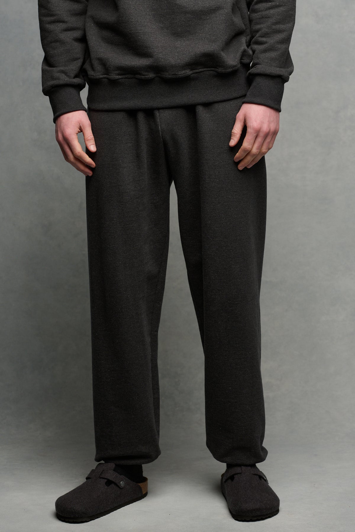 Waist down image of male wearing heritage sweatpants in charcoal