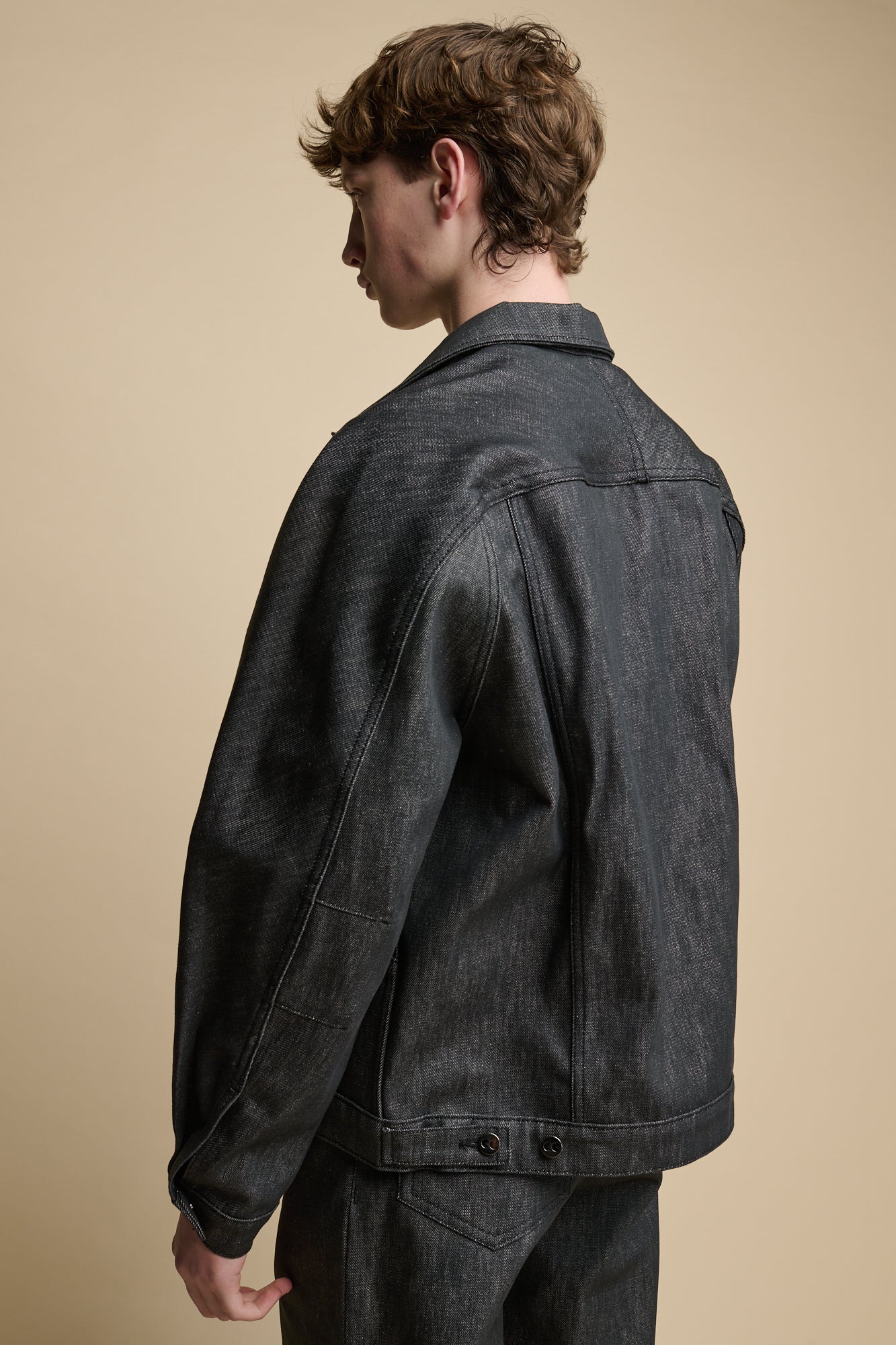 The back of male wearing Men's Joe Denim Jacket in Black