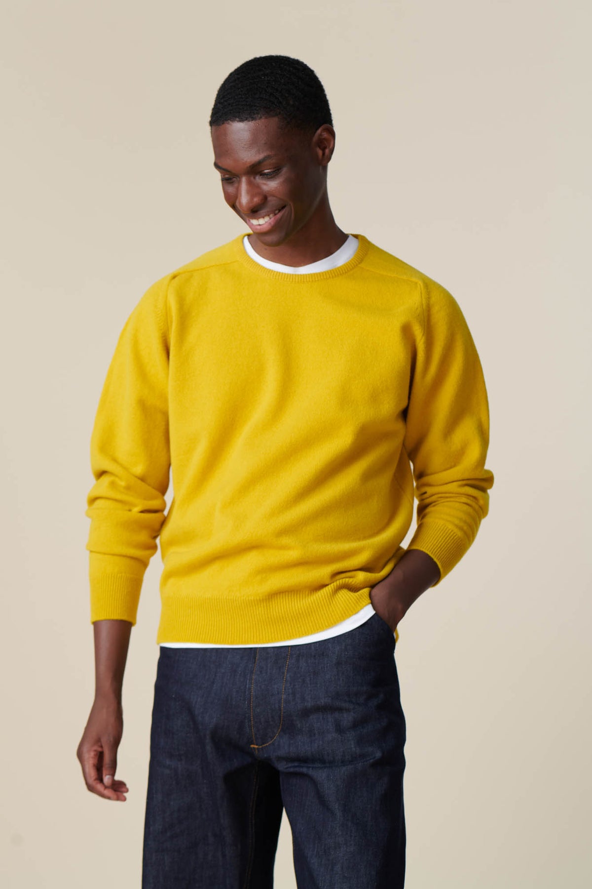 Front of male wearing lambswool crew neck in picalilli yellow