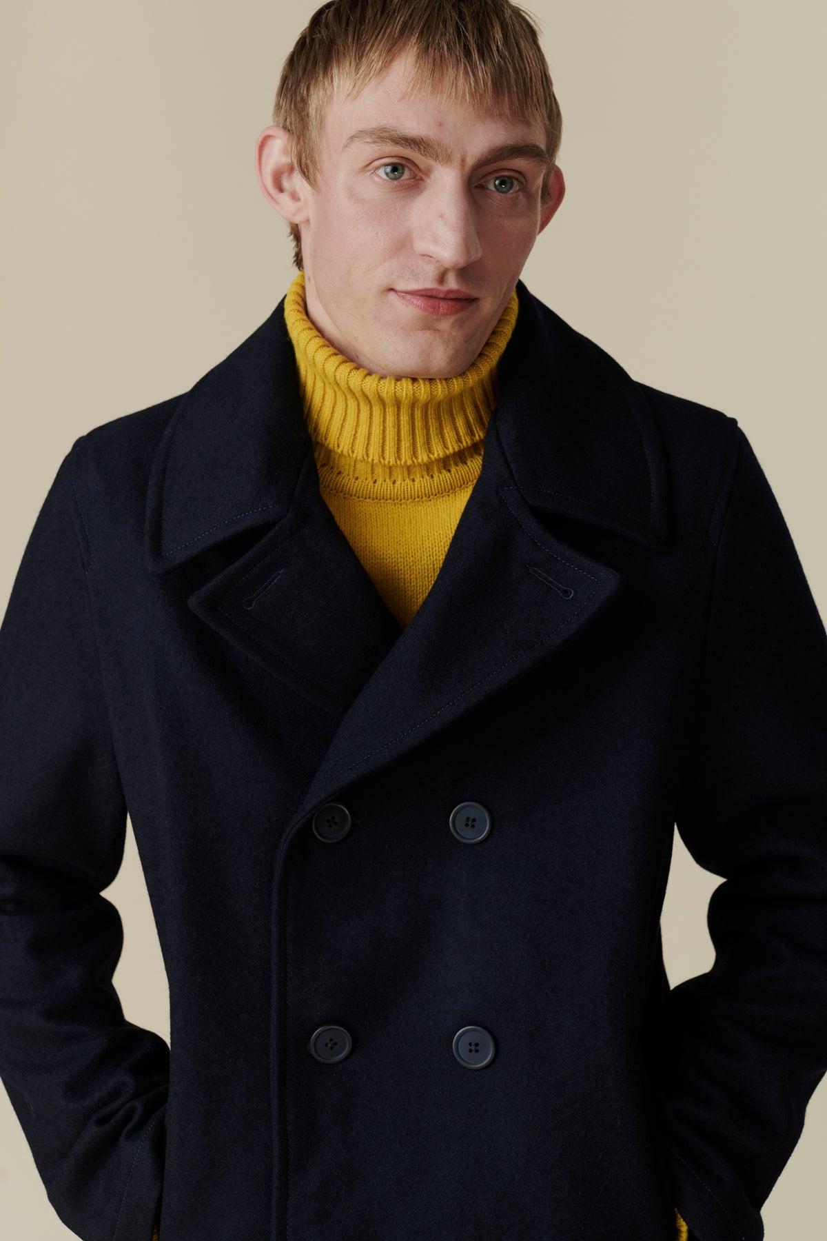 Male wearing pea coat in navy 