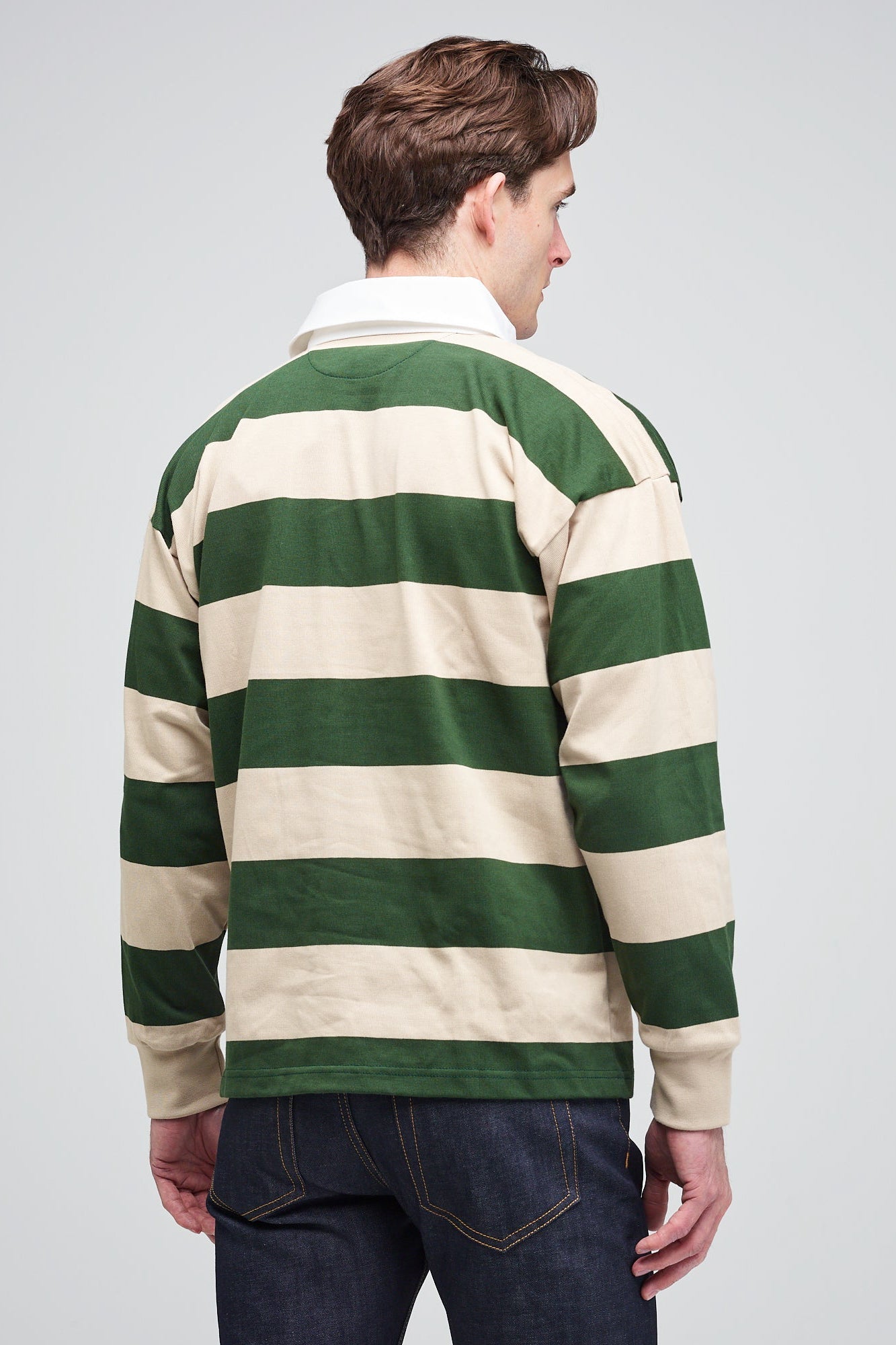 front of brunette white male in rugby shirt forest linen