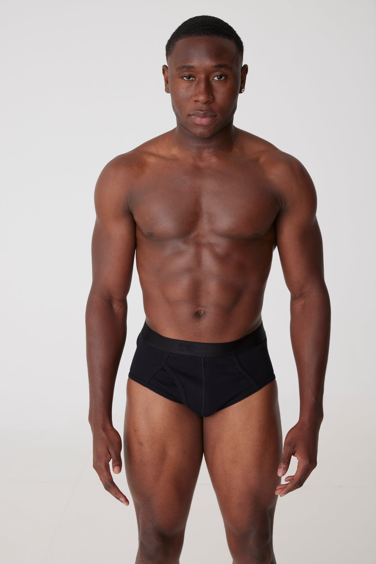 Black male face on wearing black Y-fronts 