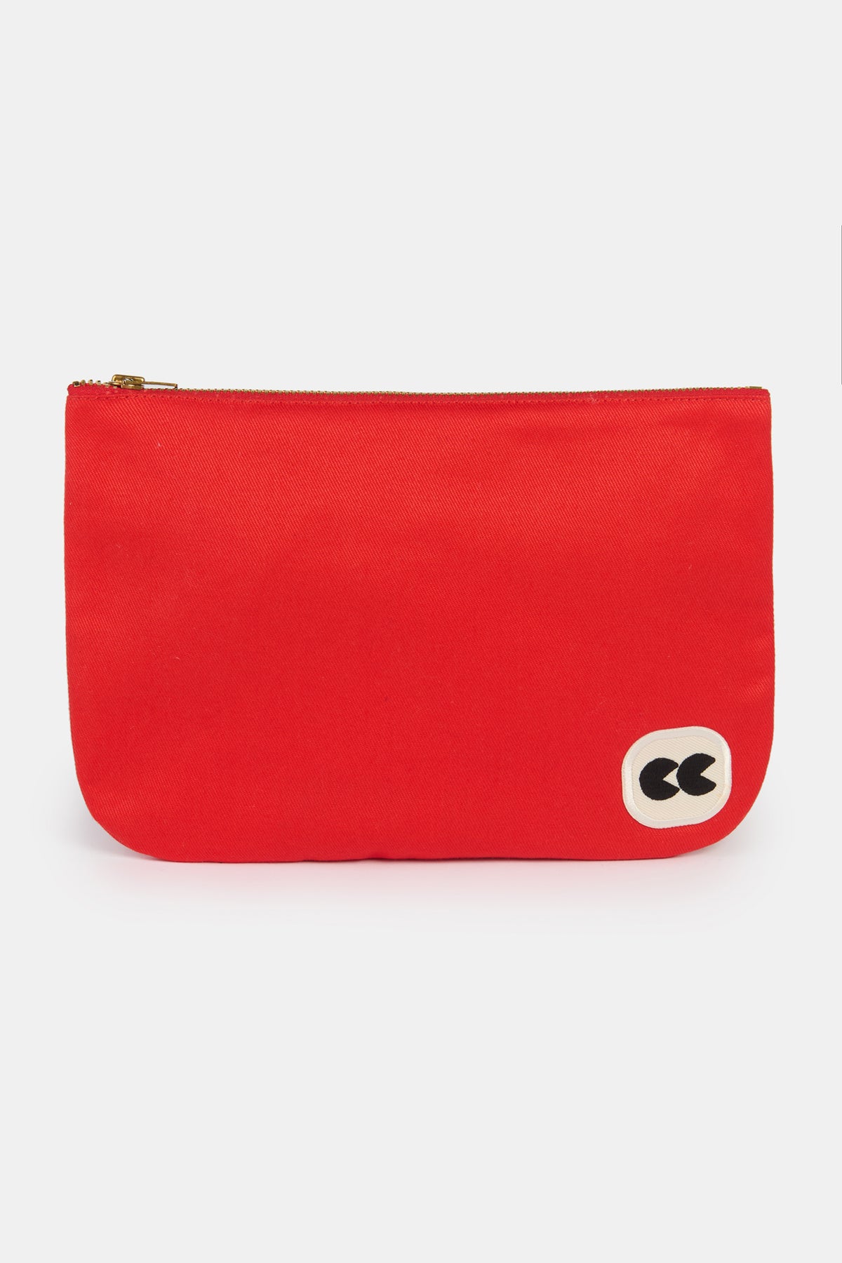 Flatlay of small pouch with CC logo patch  in the bottom right hand corner