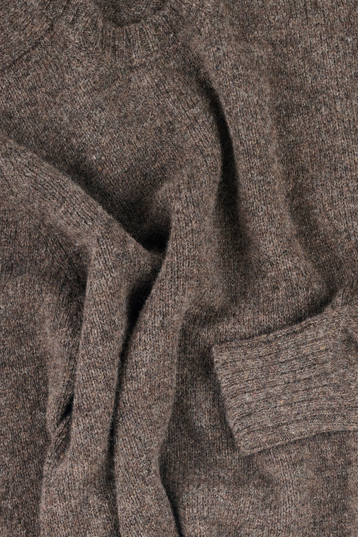 Close-up of a brown knit jumper