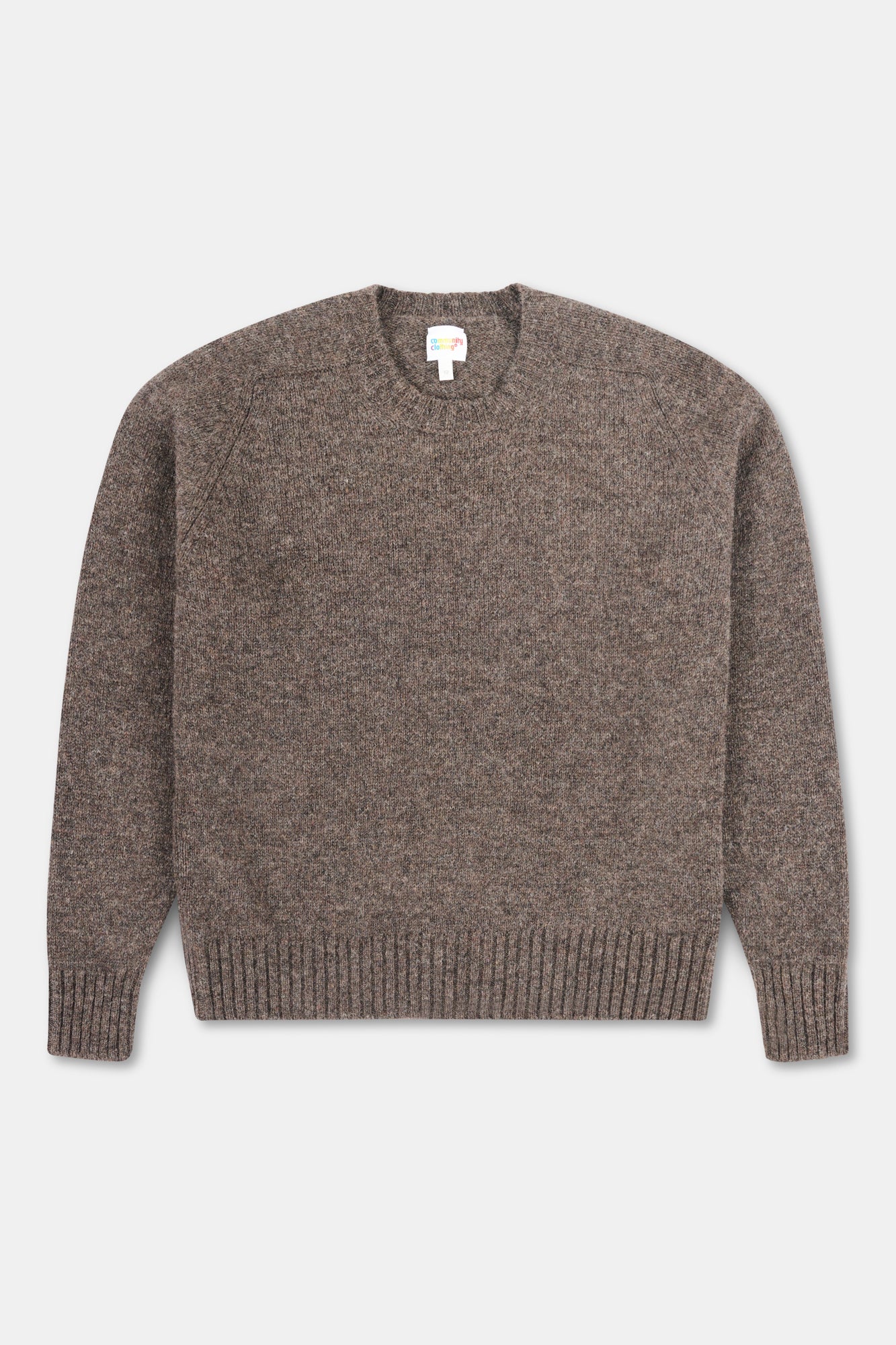 Brown jumper on white background.