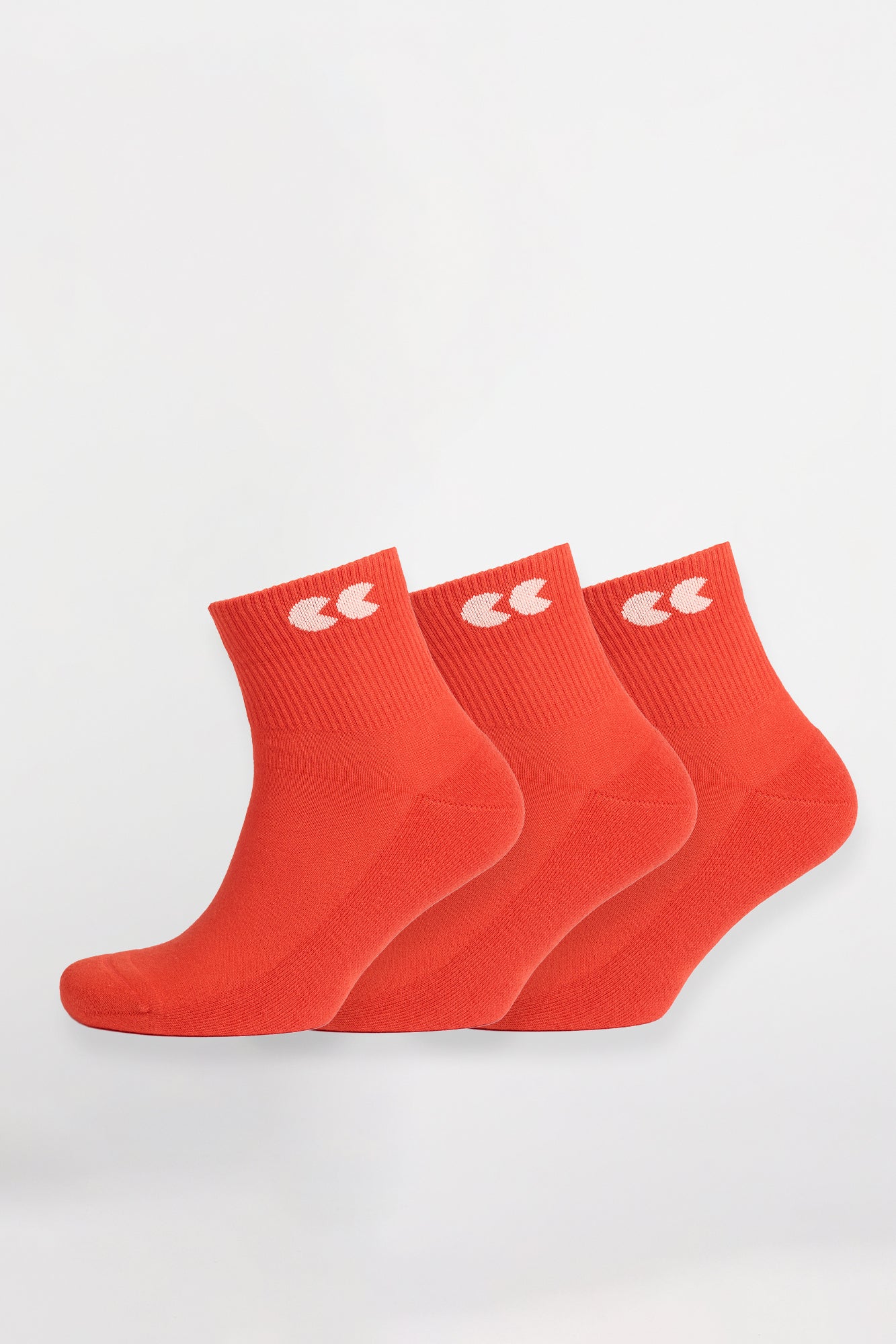 Flame red sports ankle socks worn with Community Clothing x Walsh trainers in white
