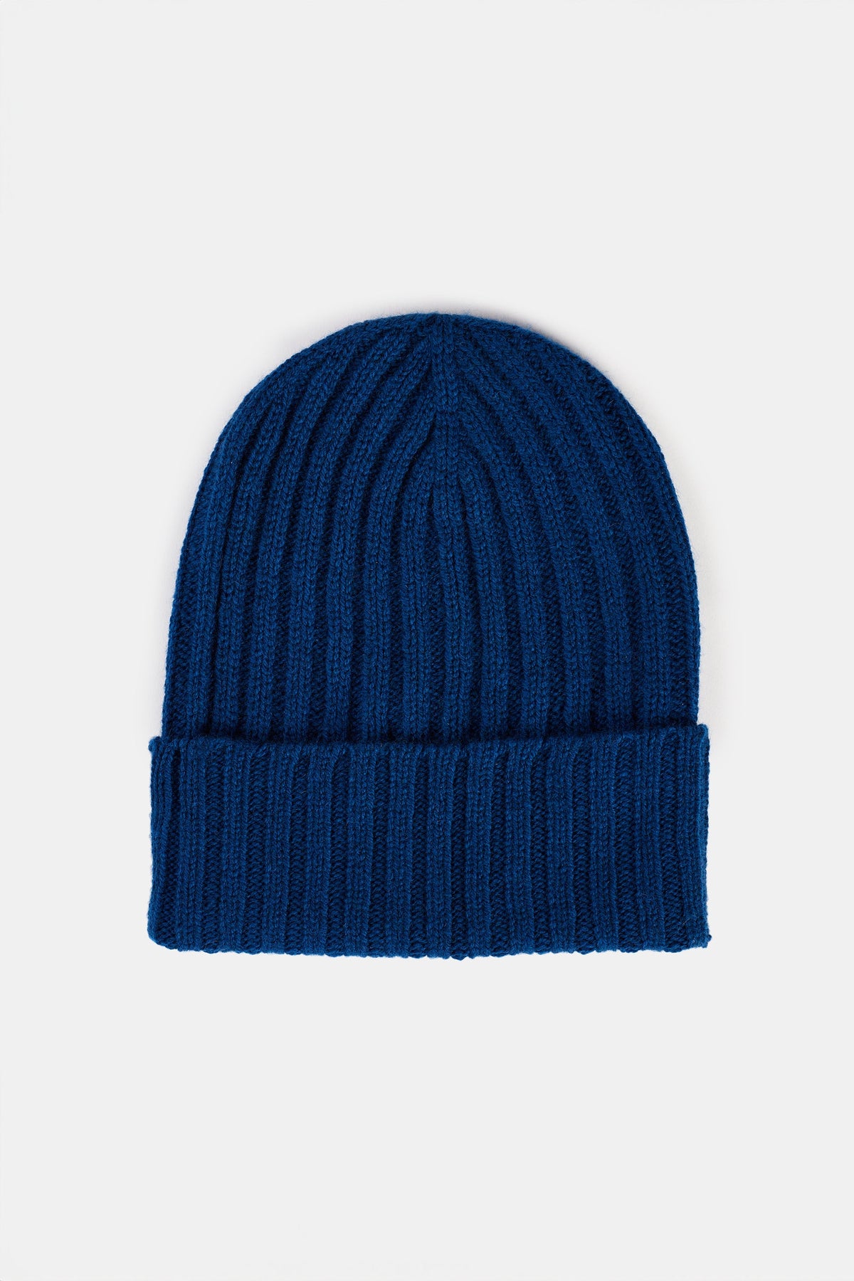 Bright blue beanie hat flatlay