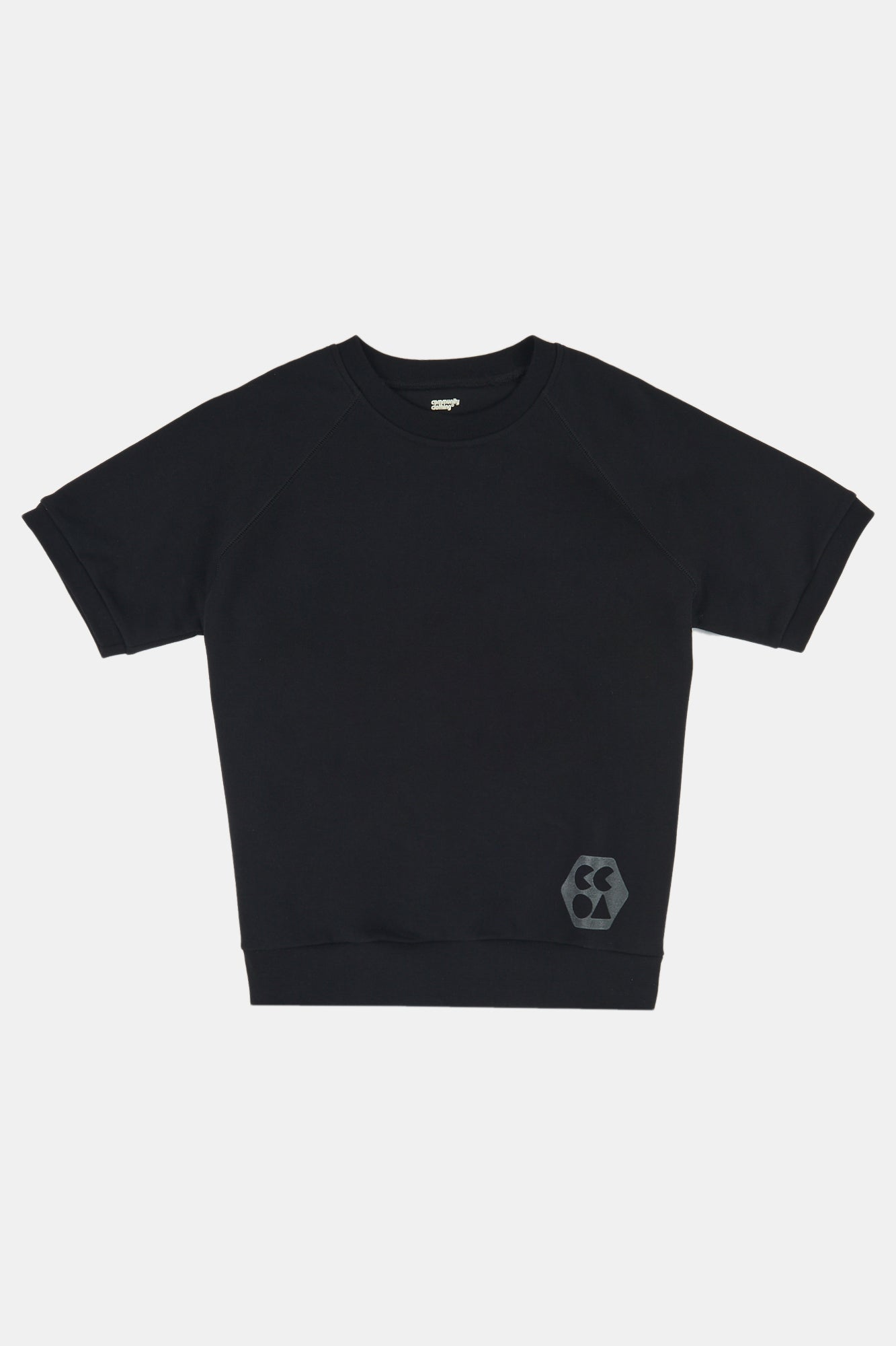 Flatlay product shot of female wearing short sleeve raglan training top plastic free in black with CCOA logo at hem