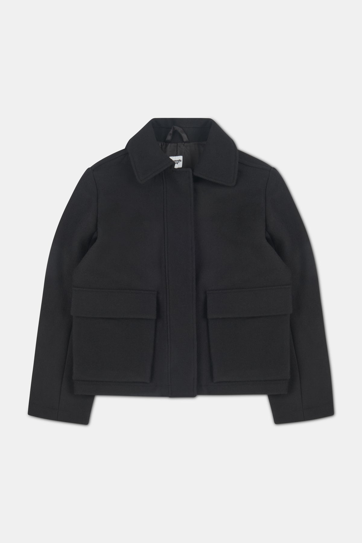 Women's short wool black coat with two front patch pockets with flaps.