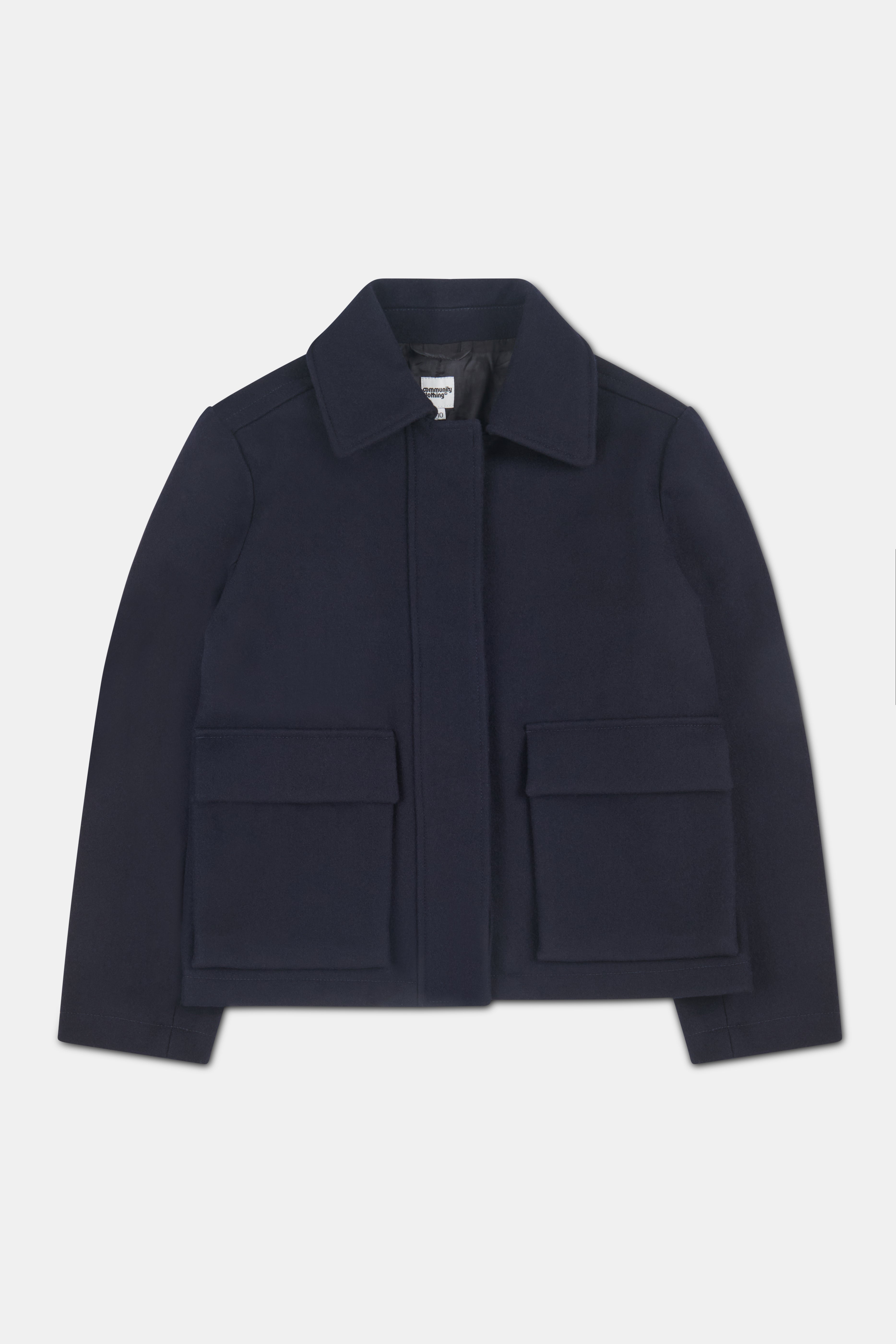 Women's navy Nancy short wool coat with two front patch pockets with flaps.
